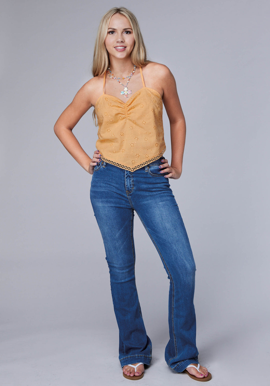 WOMENS SLEEVELESS EYELET BANDANA TANK WITH ADJUSTABLE STRAPS AND RUCHED BACK PANEL FRONT TRIM